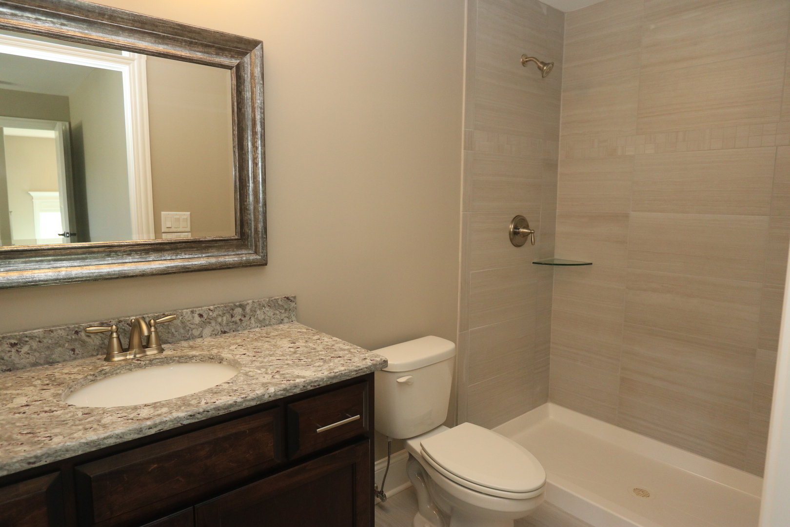 8613 High Stone Way Frankfort, IL 60423 - Photo 27 of 31 a bathroom with a granite countertop sink toilet and shower