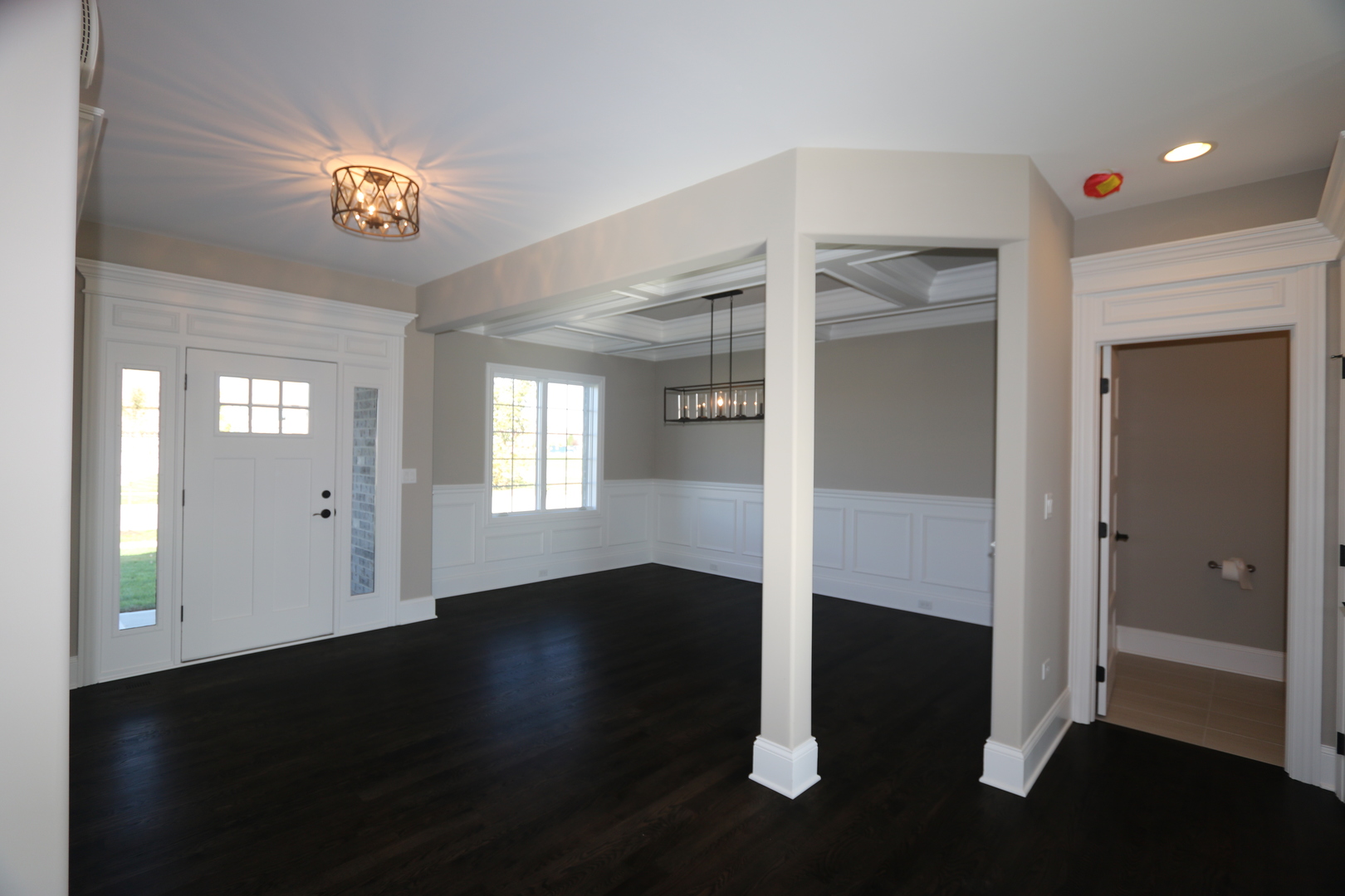 8613 High Stone Way Frankfort, IL 60423 - Photo 4 of 31 a view of an empty room with wooden floor and a living room
