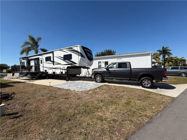 a view of a car park in front of a house