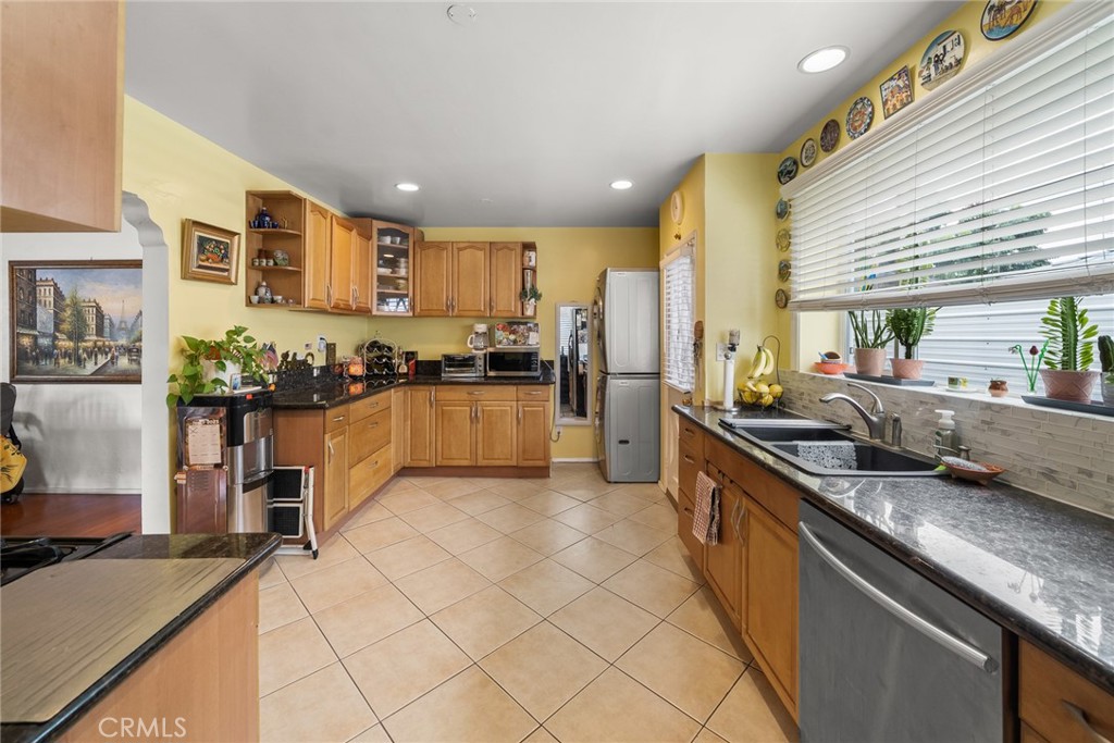 4006 York Boulevard Los Angeles, CA 90065 - Photo 12 of 33 a kitchen with stainless steel appliances granite countertop a sink and cabinets