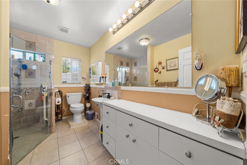 4006 York Boulevard Los Angeles, CA 90065 - Photo 16 of 33 a spacious bathroom with a double vanity sink a mirror and a shower