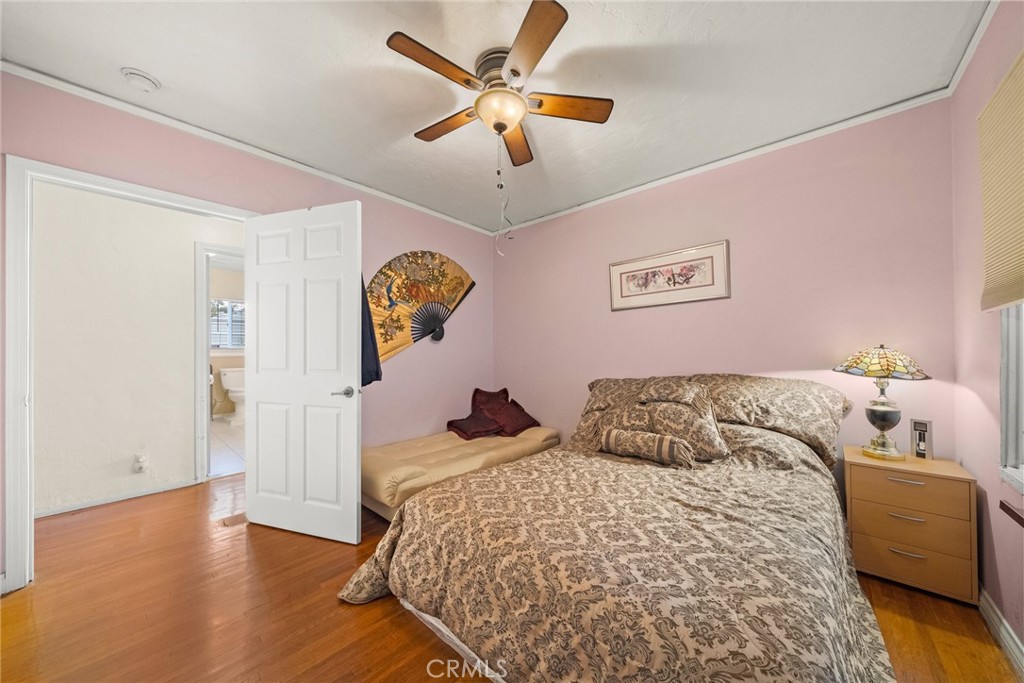 4006 York Boulevard Los Angeles, CA 90065 - Photo 19 of 33 a bedroom with a bed and a chandelier
