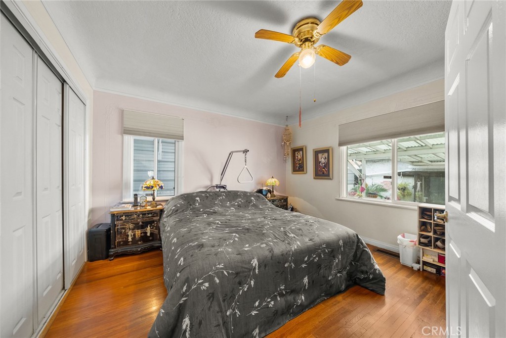 4006 York Boulevard Los Angeles, CA 90065 - Photo 20 of 33 a bedroom with a bed and a chandelier