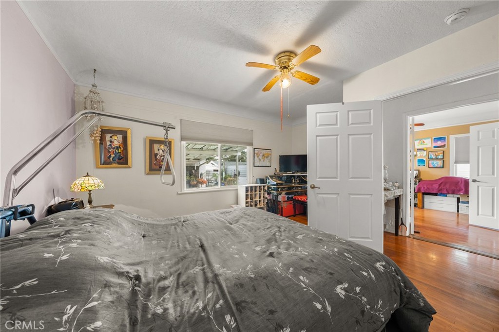4006 York Boulevard Los Angeles, CA 90065 - Photo 21 of 33 a view of a bedroom with a bed and ceiling fan