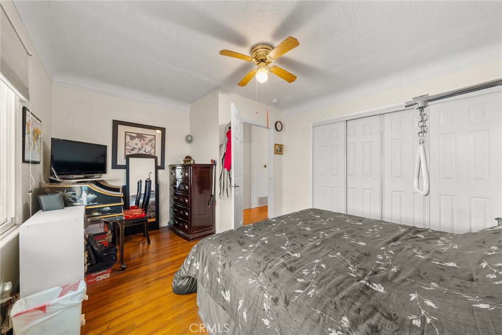 4006 York Boulevard Los Angeles, CA 90065 - Photo 22 of 33 a bed room with a bed and a flat screen tv