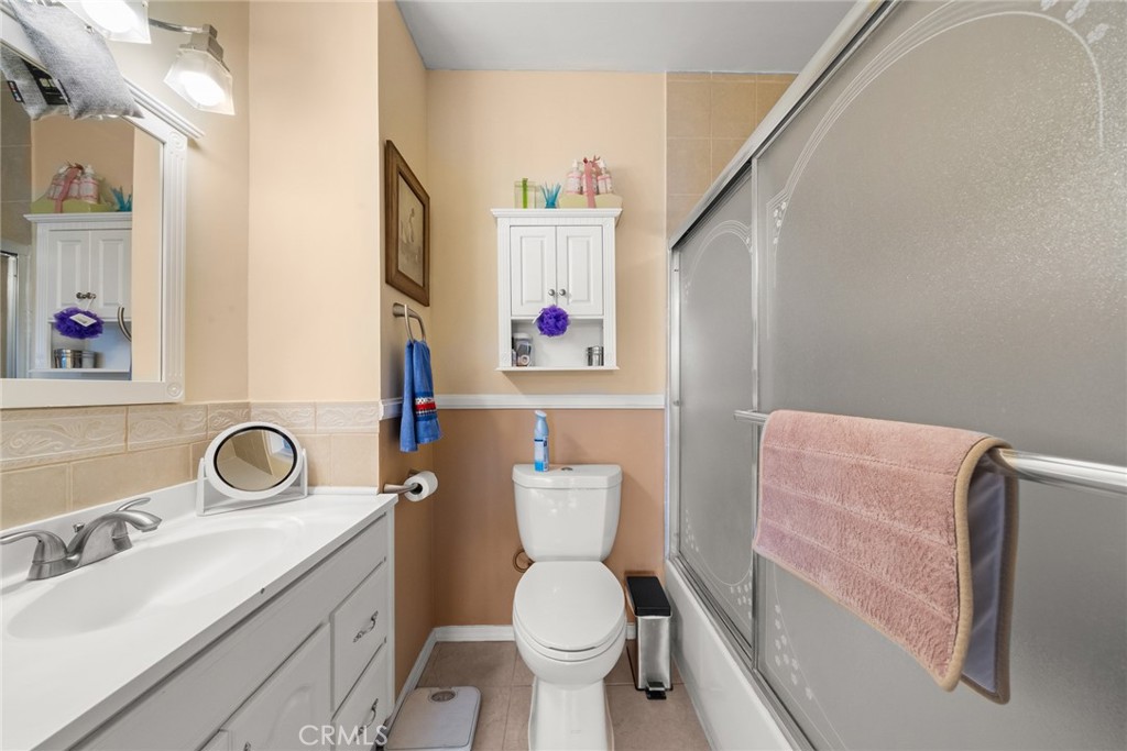 4006 York Boulevard Los Angeles, CA 90065 - Photo 25 of 33 a bathroom with a sink a toilet and a mirror