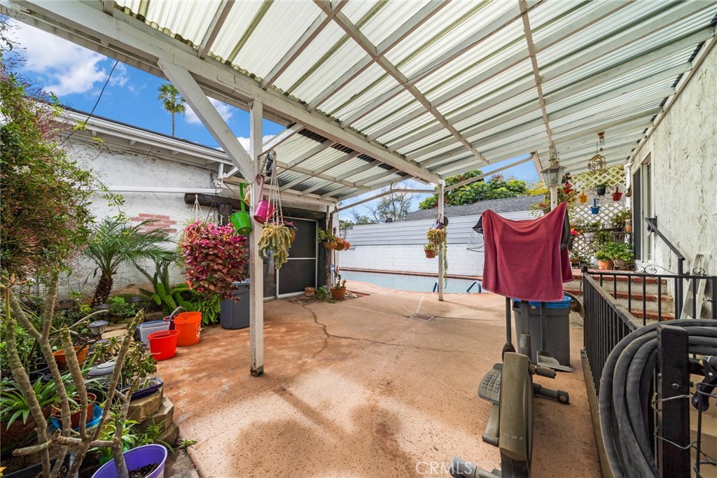4006 York Boulevard Los Angeles, CA 90065 - Photo 26 of 33 a view of a patio with table and chairs potted plants