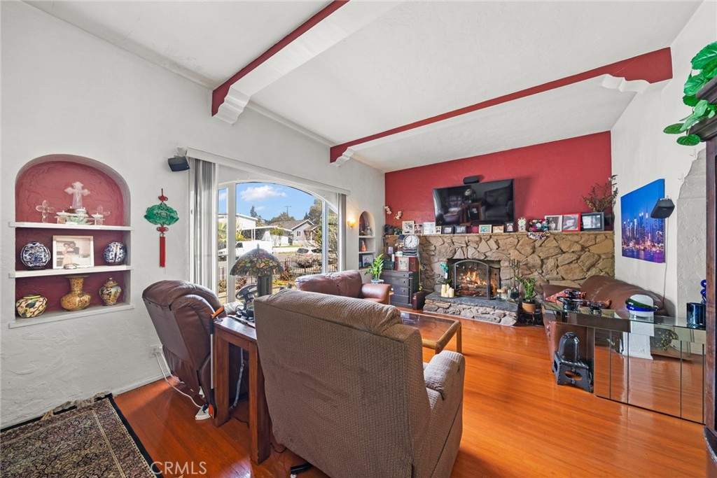 4006 York Boulevard Los Angeles, CA 90065 - Photo 7 of 33 a living room with furniture a flat screen tv and wooden floor