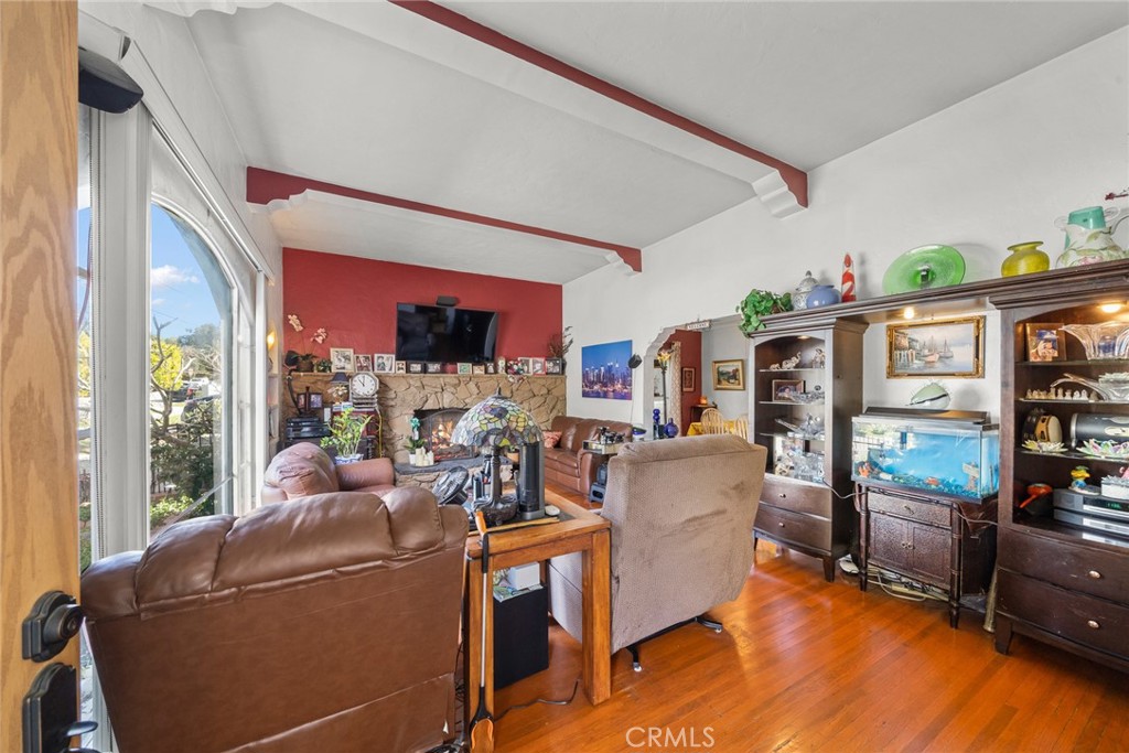 4006 York Boulevard Los Angeles, CA 90065 - Photo 8 of 33 a living room with furniture and a flat screen tv