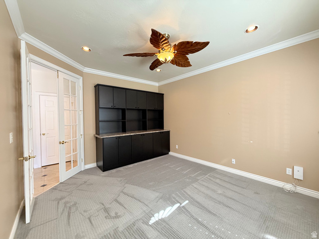 1562 Fairway Ridge Road Draper, UT 84020 - Photo 33 of 60 Room featuring built-in dark cabinetry with a light-toned countertop, recessed lighting, and a ceiling fan with decorative blades