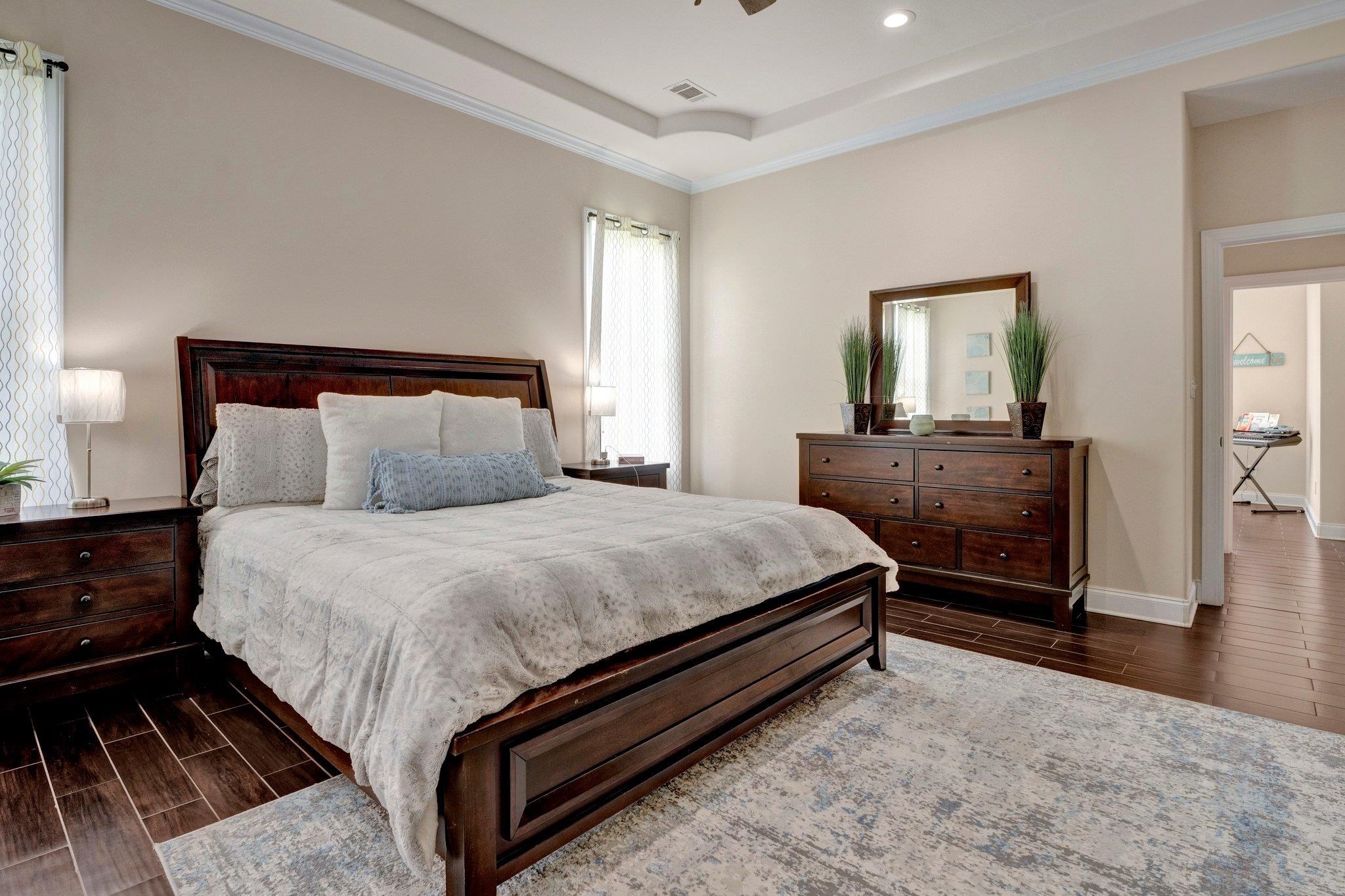 3270 Rast Road Millington, TN 38053 - Photo 24 of 40 Bedroom featuring wood finish floors, ornamental molding, a raised ceiling, a ceiling fan, and recessed lighting