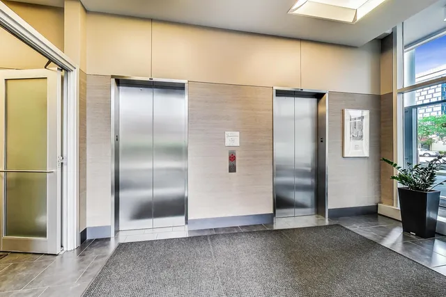 an empty room with potted plants