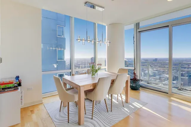 a view of a dining room with furniture window and outside view