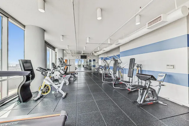 a kitchen with stainless steel appliances a sink dishwasher a stove a microwave oven and cabinets