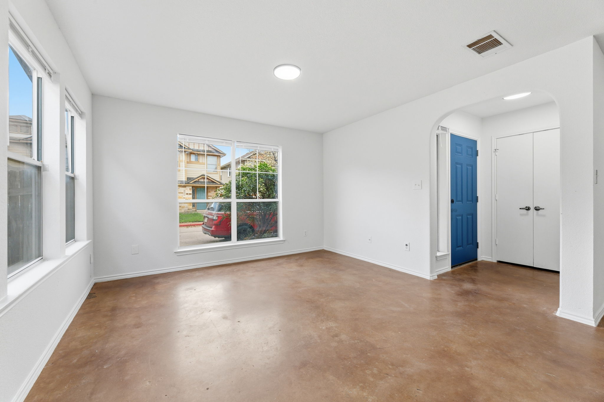 4516 Felicity Lane Austin, TX 78725 - Photo 5 of 33 Bright living room with large windows that provide natural light