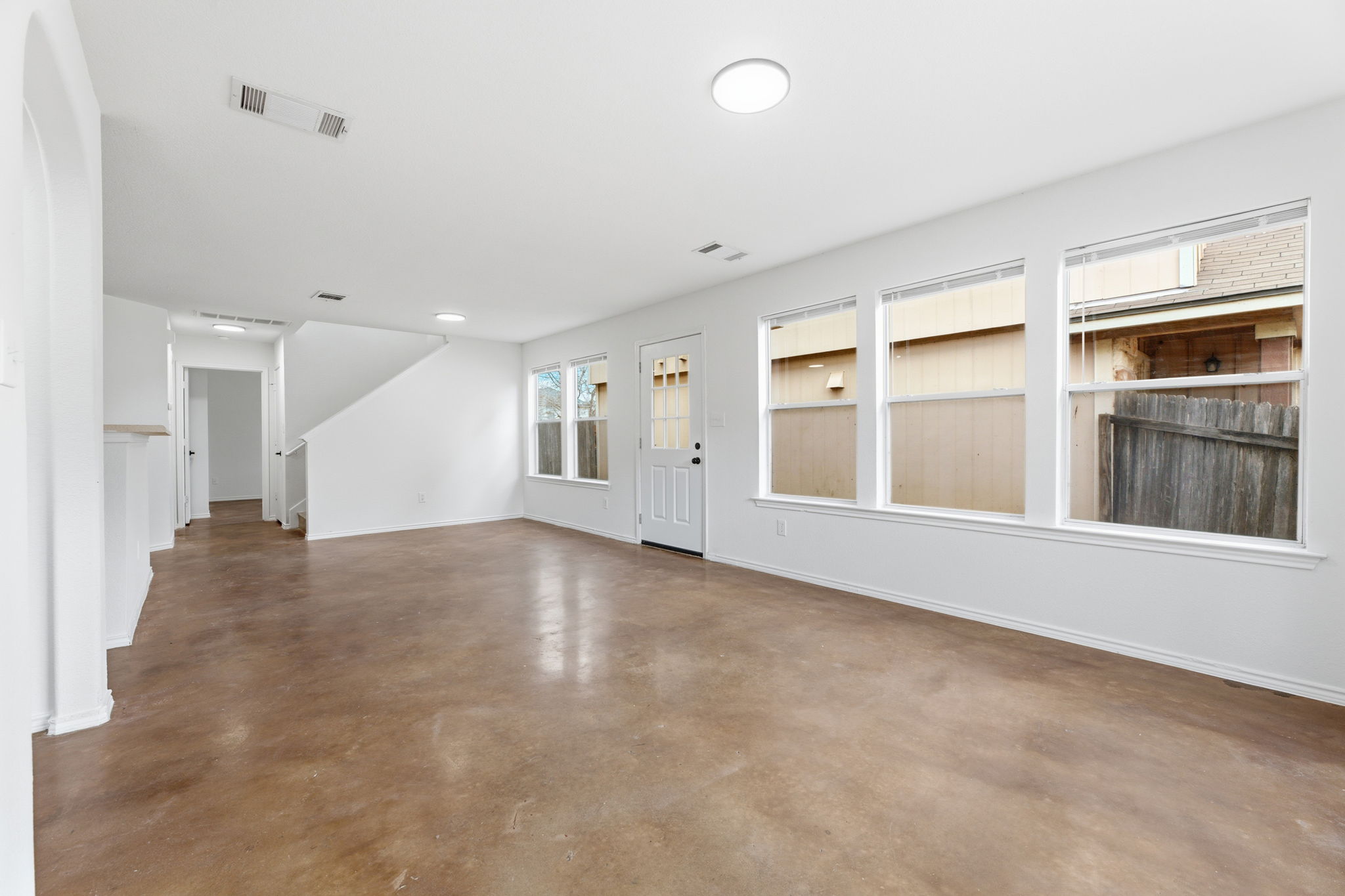 4516 Felicity Lane Austin, TX 78725 - Photo 9 of 33 Stained concrete flooring ~ easy living!