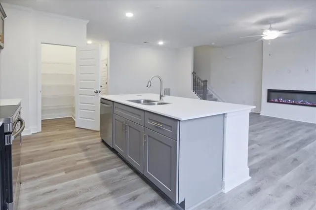 a kitchen with a sink and cabinets
