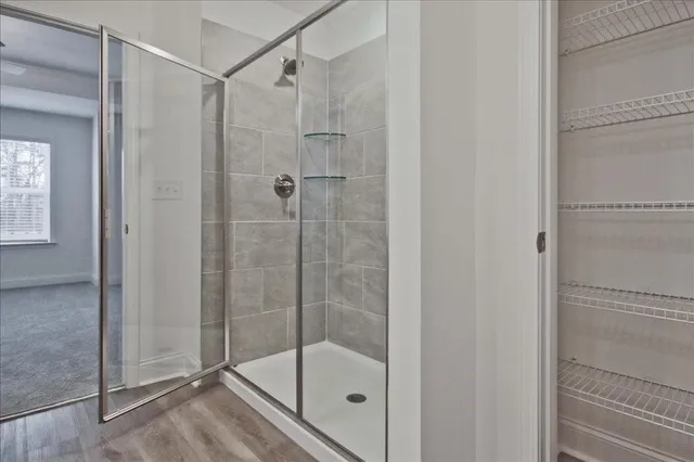 a bathroom with a double vanity sink and a mirror