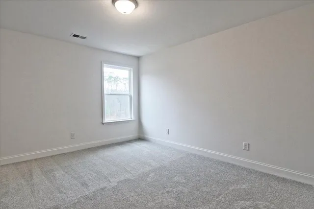 a view of an empty room and entryway