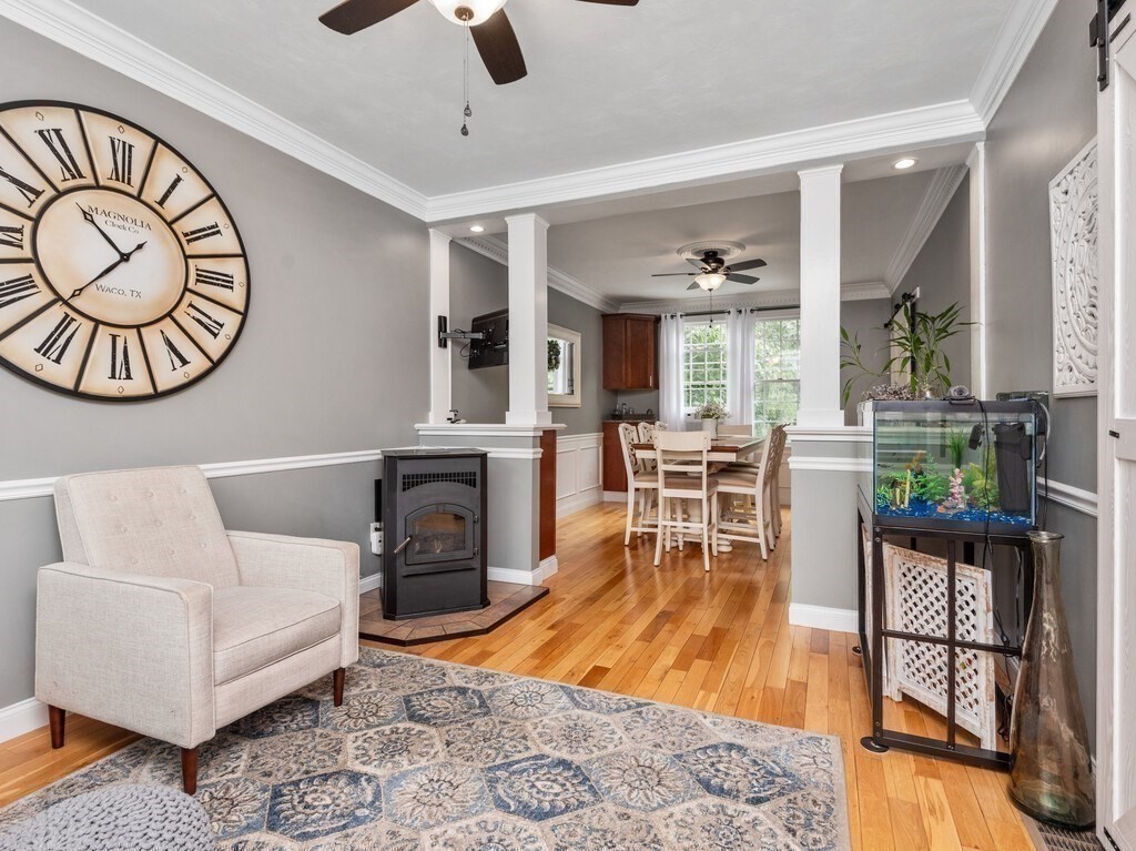 40 Rustic Drive Worcester, MA 01609 - Photo 12 of 39 a living room with furniture a rug and a floor to ceiling window