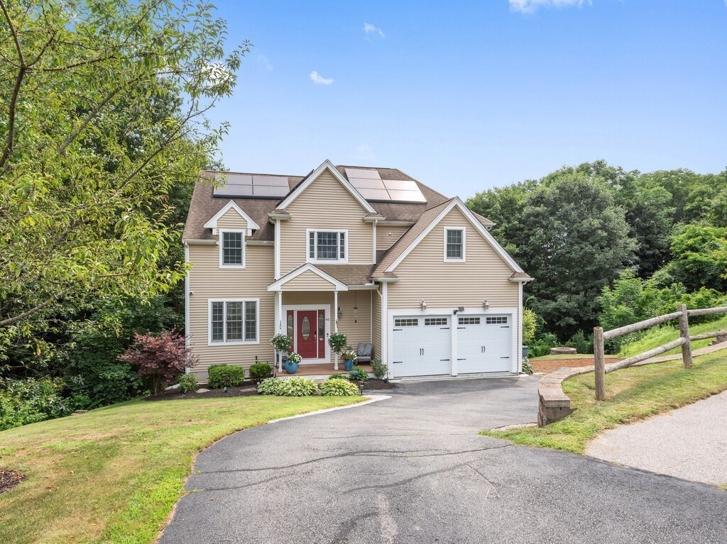 40 Rustic Drive Worcester, MA 01609 - Photo 2 of 39 a front view of a house with a yard and garage