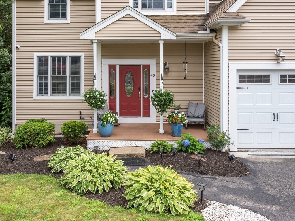 40 Rustic Drive Worcester, MA 01609 - Photo 3 of 39 a front view of a house with garden