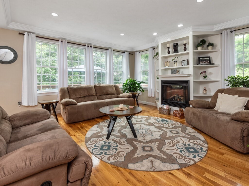 40 Rustic Drive Worcester, MA 01609 - Photo 7 of 39 a living room with furniture large window and a fireplace