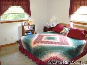 567 Old Newfound Road Leicester, NC 28748 - Photo 7 of 12 a bedroom with a bed and a window