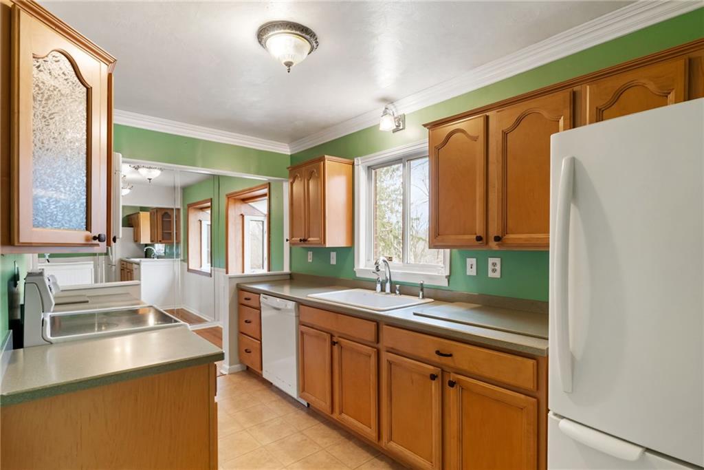 107 Marshall Drive Coraopolis, PA 15108 - Photo 12 of 32 a kitchen with a sink stove and cabinets