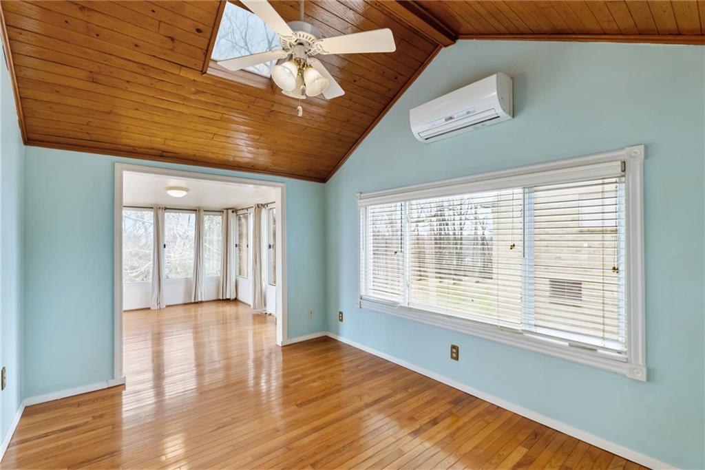 107 Marshall Drive Coraopolis, PA 15108 - Photo 16 of 32 a view of an empty room with wooden floor and a window