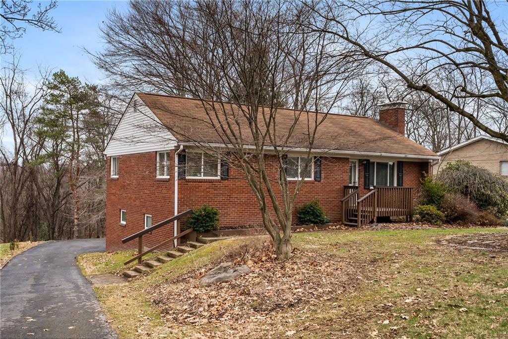107 Marshall Drive Coraopolis, PA 15108 - Photo 2 of 32 a front view of a house with a yard