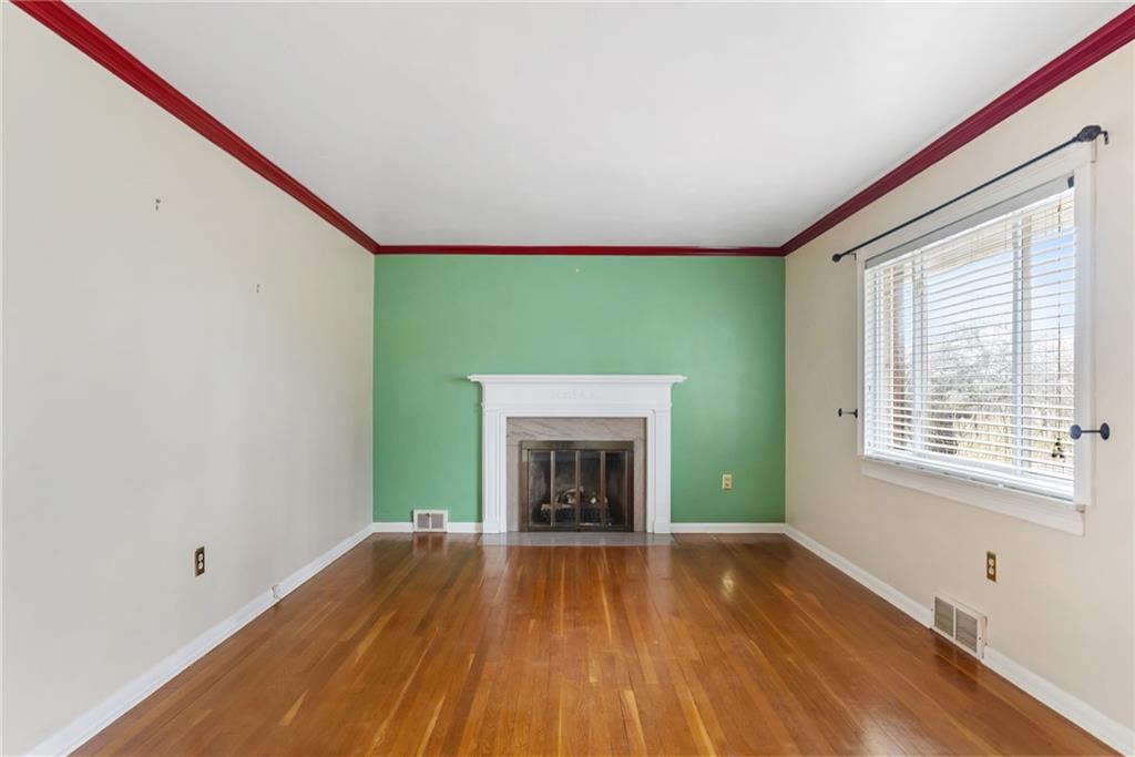 107 Marshall Drive Coraopolis, PA 15108 - Photo 6 of 32 a view of an empty room with window and fire place