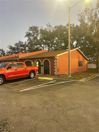 a front view of a house with parking space