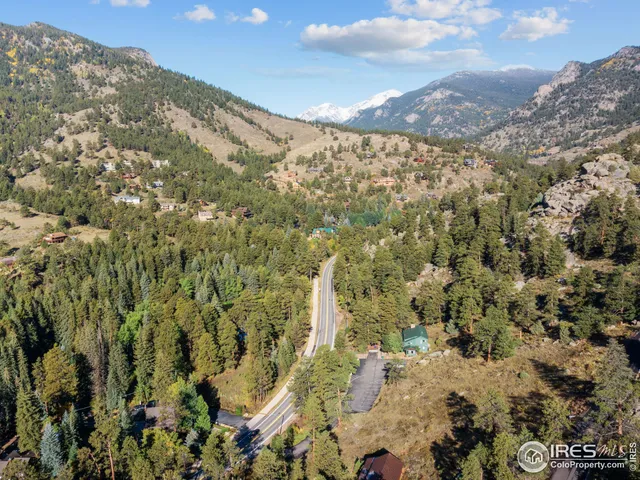a view of a city with mountains in the background