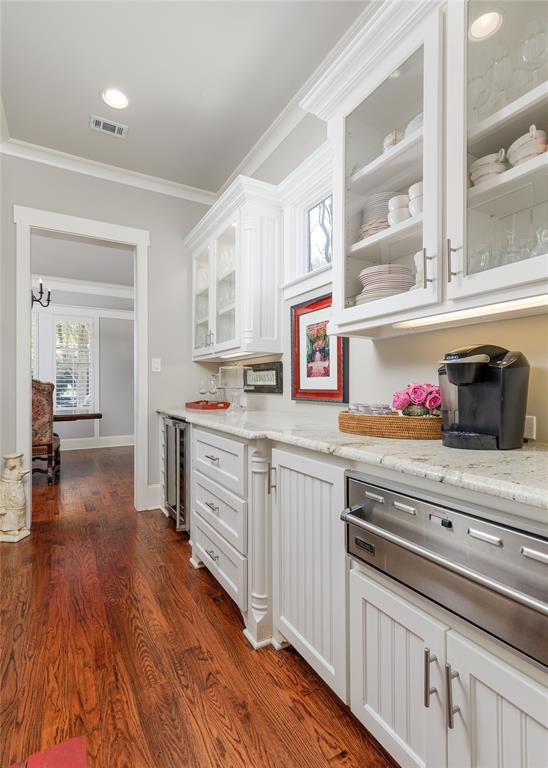 7304 Ripley Street McKinney, TX 75071 - Photo 18 of 40 Butler's pantry between the kitchen and dining room offers a warming drawer and wine fridge.