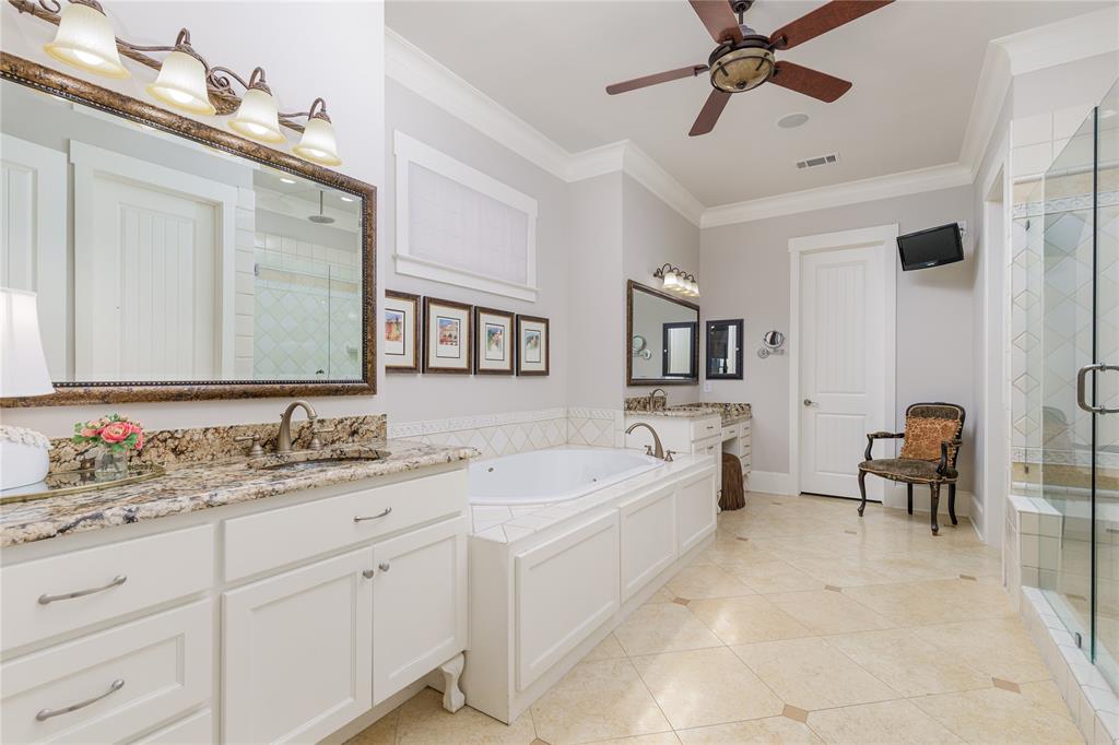 7304 Ripley Street McKinney, TX 75071 - Photo 20 of 40 Primary bathroom features a large tub and dual vanities.