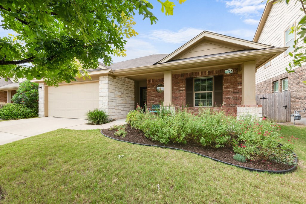 4545 Tiddle Lane Pflugerville, TX 78660 - Photo 1 of 1 front view of a house with a yard