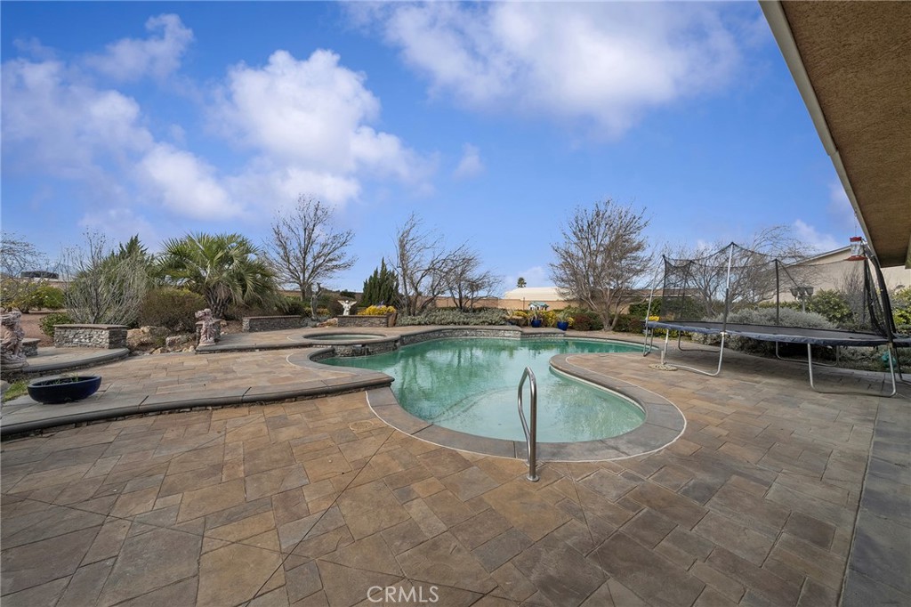 7172 Jargon Road Hesperia, CA 92344 - Photo 60 of 75 a view of swimming pool with outdoor seating and plants