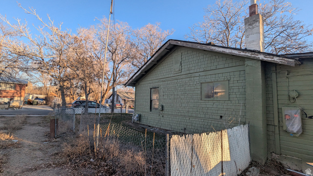 436 Rose Avenue Price, UT 84501 - Photo 28 of 36 Gabled roofline with exposed eaves, exterior siding, and concrete chimney