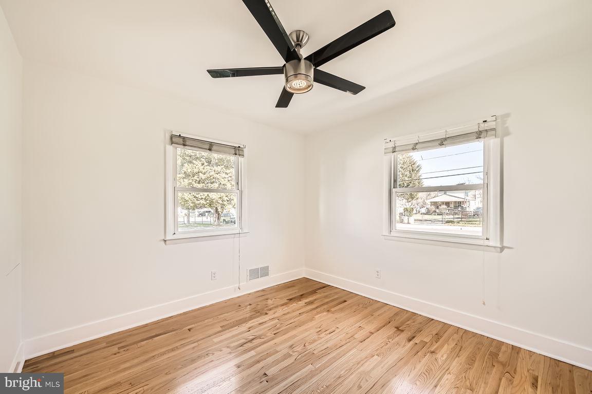 317 Townsend Road Essex, MD 21221 - Photo 15 of 28 a view of empty room with wooden floor