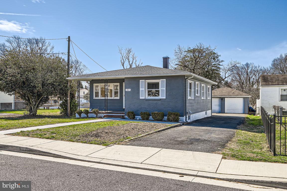 317 Townsend Road Essex, MD 21221 - Photo 2 of 28 a front view of a house with a yard