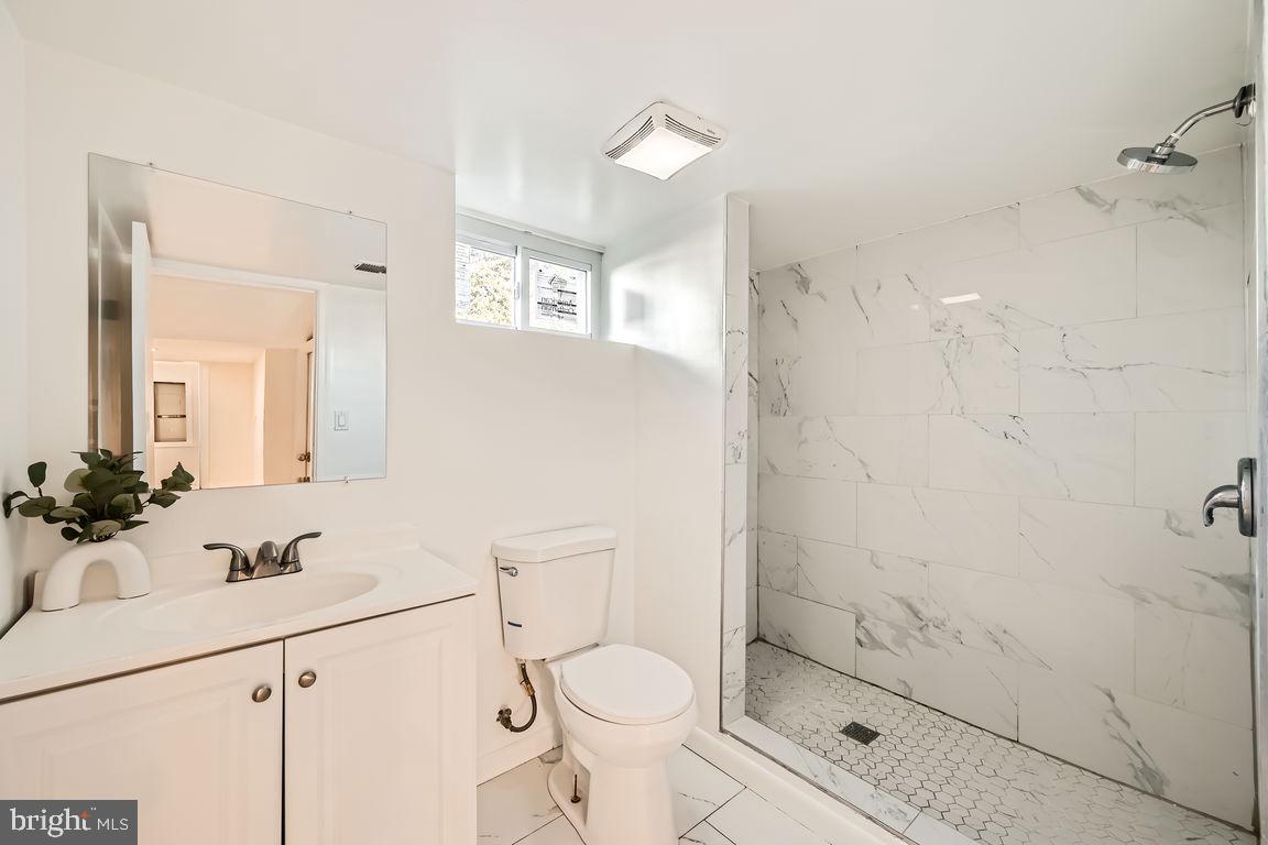 317 Townsend Road Essex, MD 21221 - Photo 21 of 28 a bathroom with a sink toilet and shower