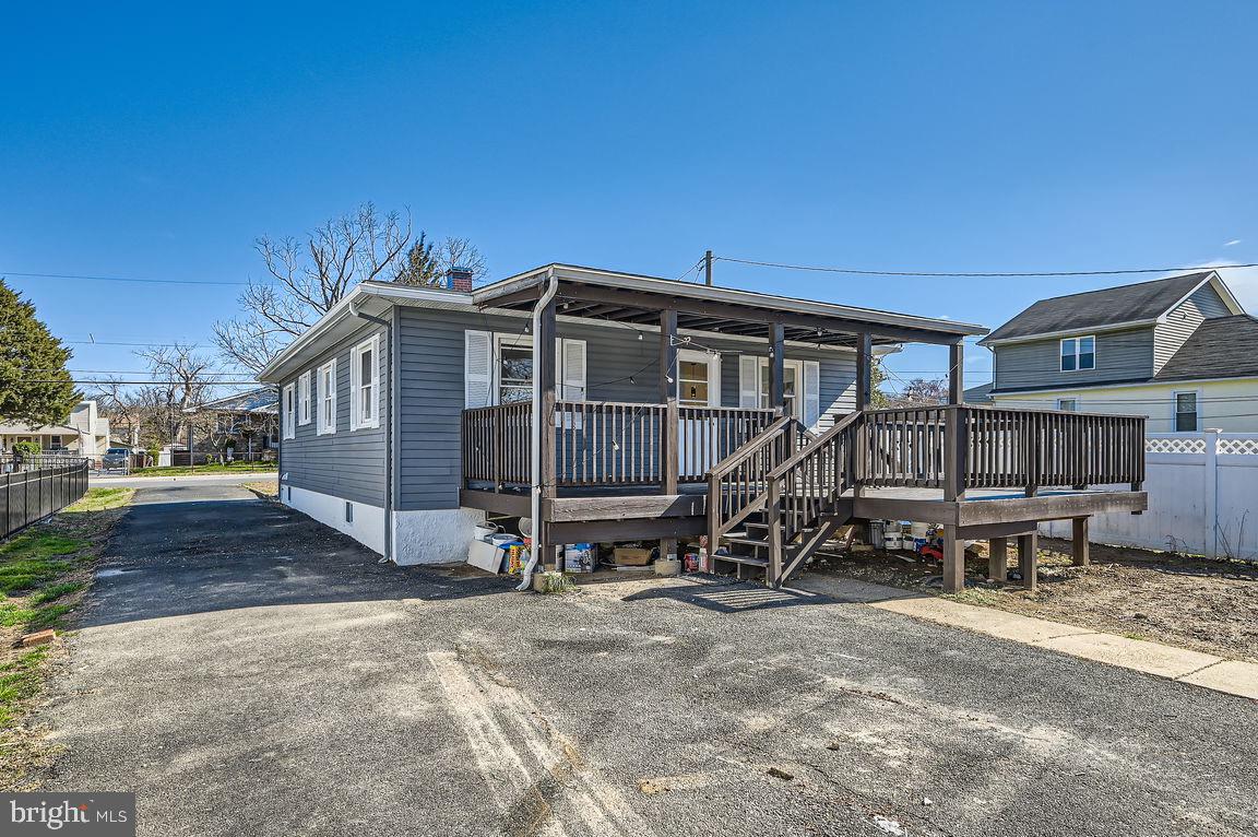 317 Townsend Road Essex, MD 21221 - Photo 26 of 28 a view of a house with a wooden deck