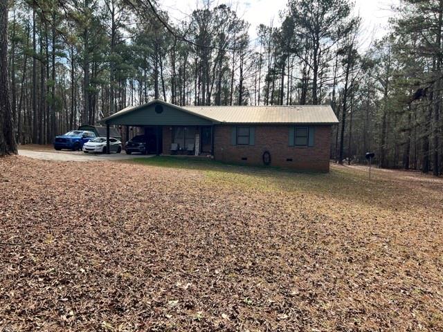 a couple of table and chairs under an umbrella