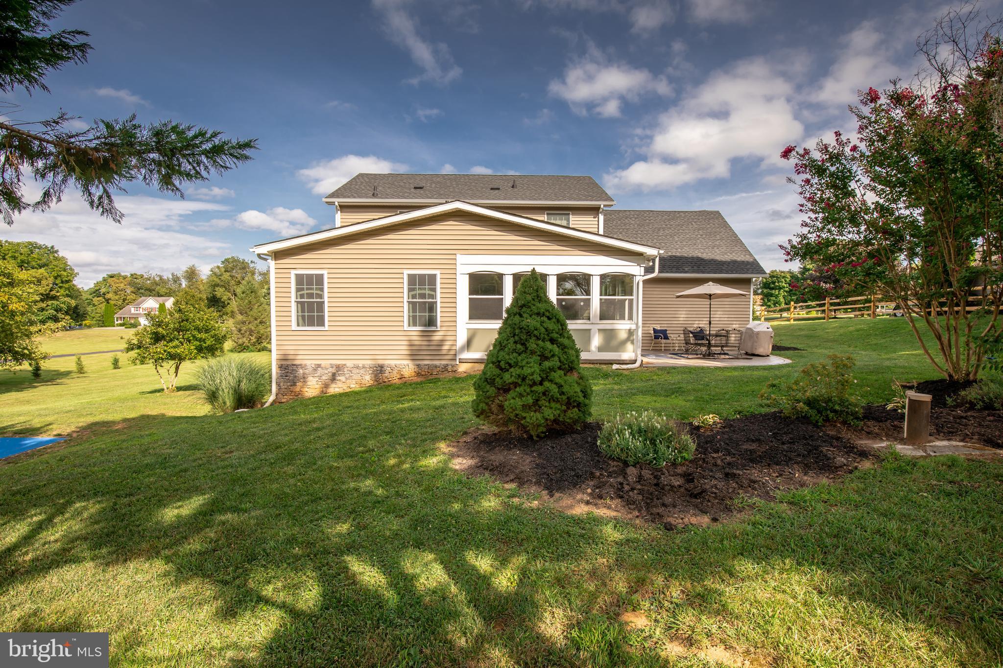 193 Quail Run Road Summit Point, WV 25446 - Photo 11 of 72 a front view of a house with a yard