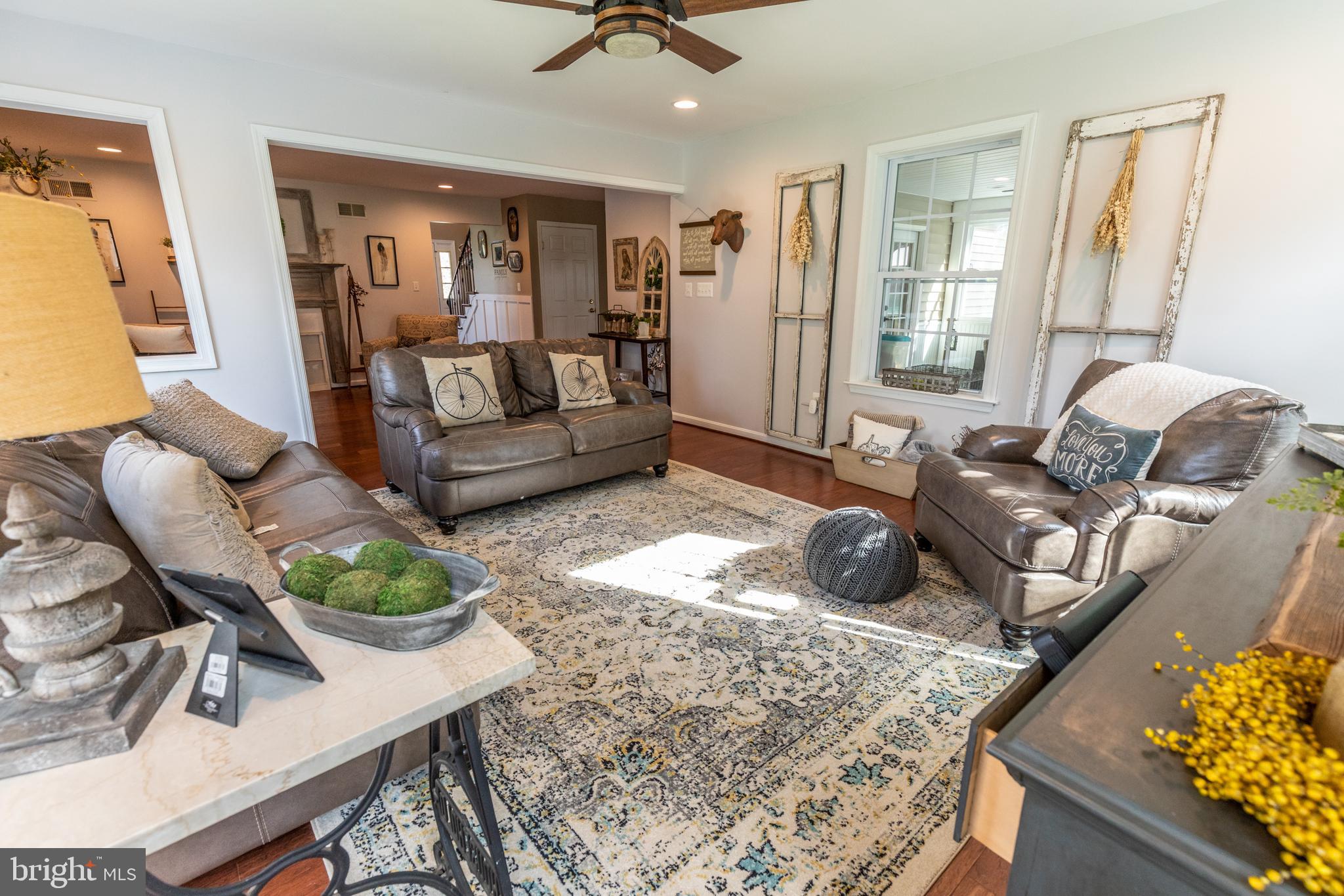 193 Quail Run Road Summit Point, WV 25446 - Photo 37 of 72 a living room with furniture and wooden floor