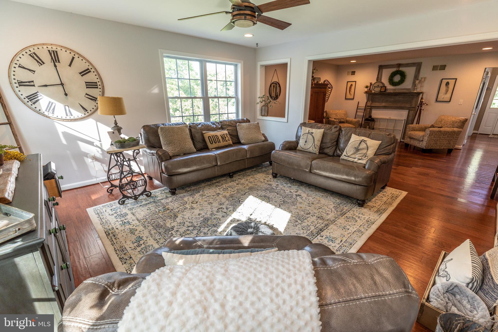 193 Quail Run Road Summit Point, WV 25446 - Photo 38 of 72 a living room with furniture and a large window