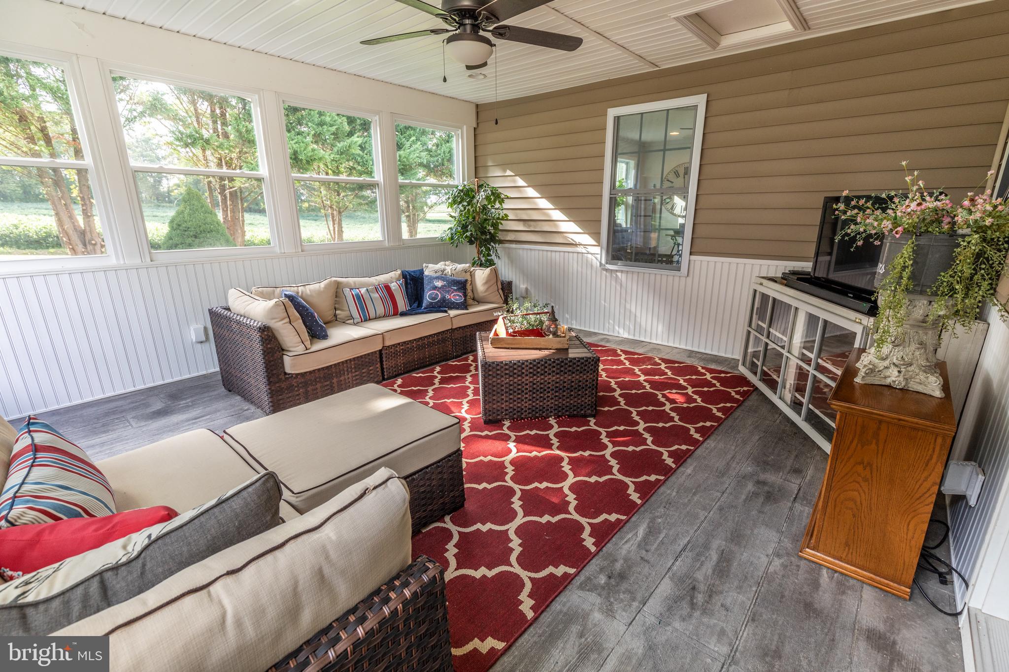 193 Quail Run Road Summit Point, WV 25446 - Photo 61 of 72 a living room with furniture and a window
