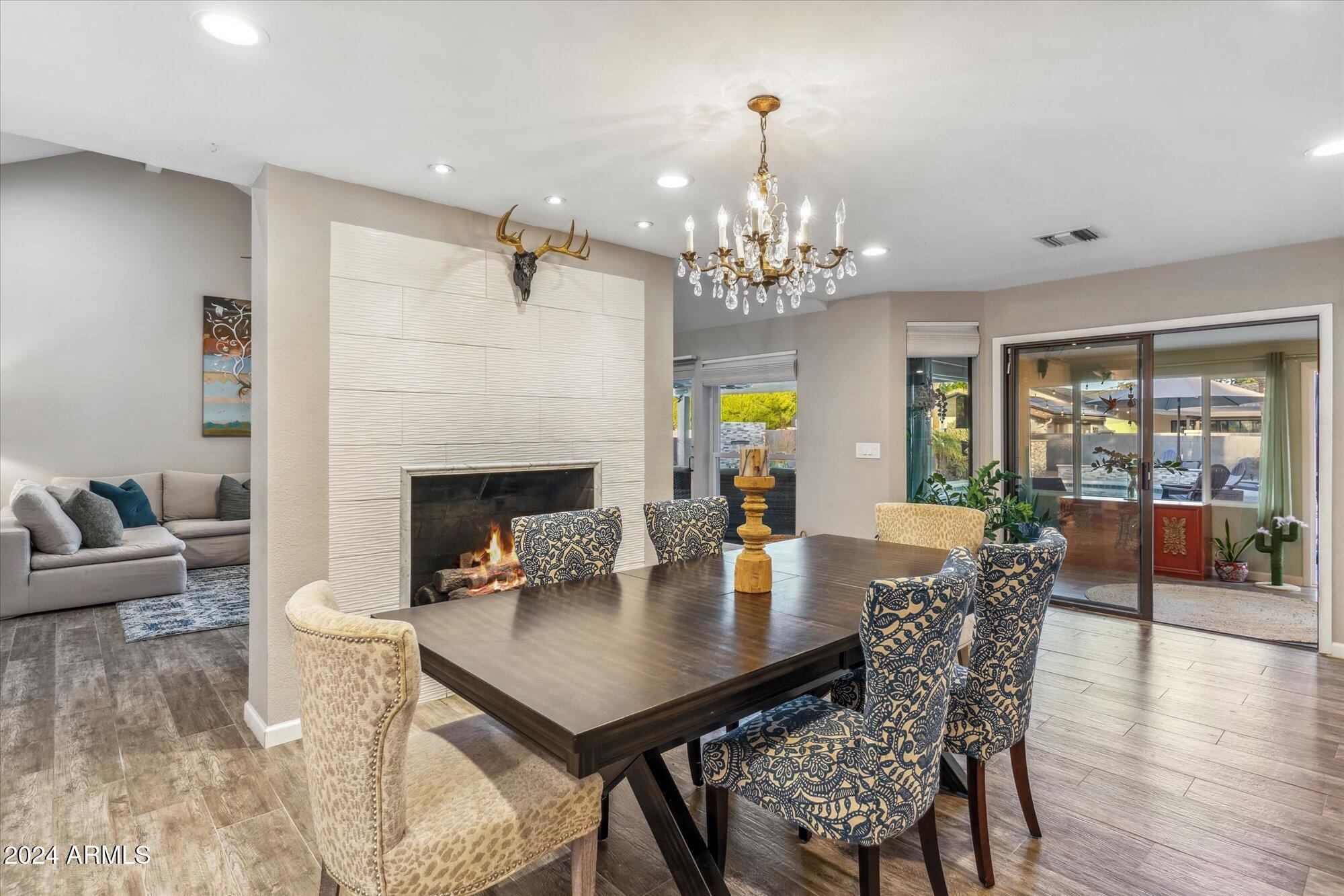 8019 North 7th Avenue Phoenix, AZ 85021 - Photo 13 of 43 a view of a dining room with furniture and wooden floor