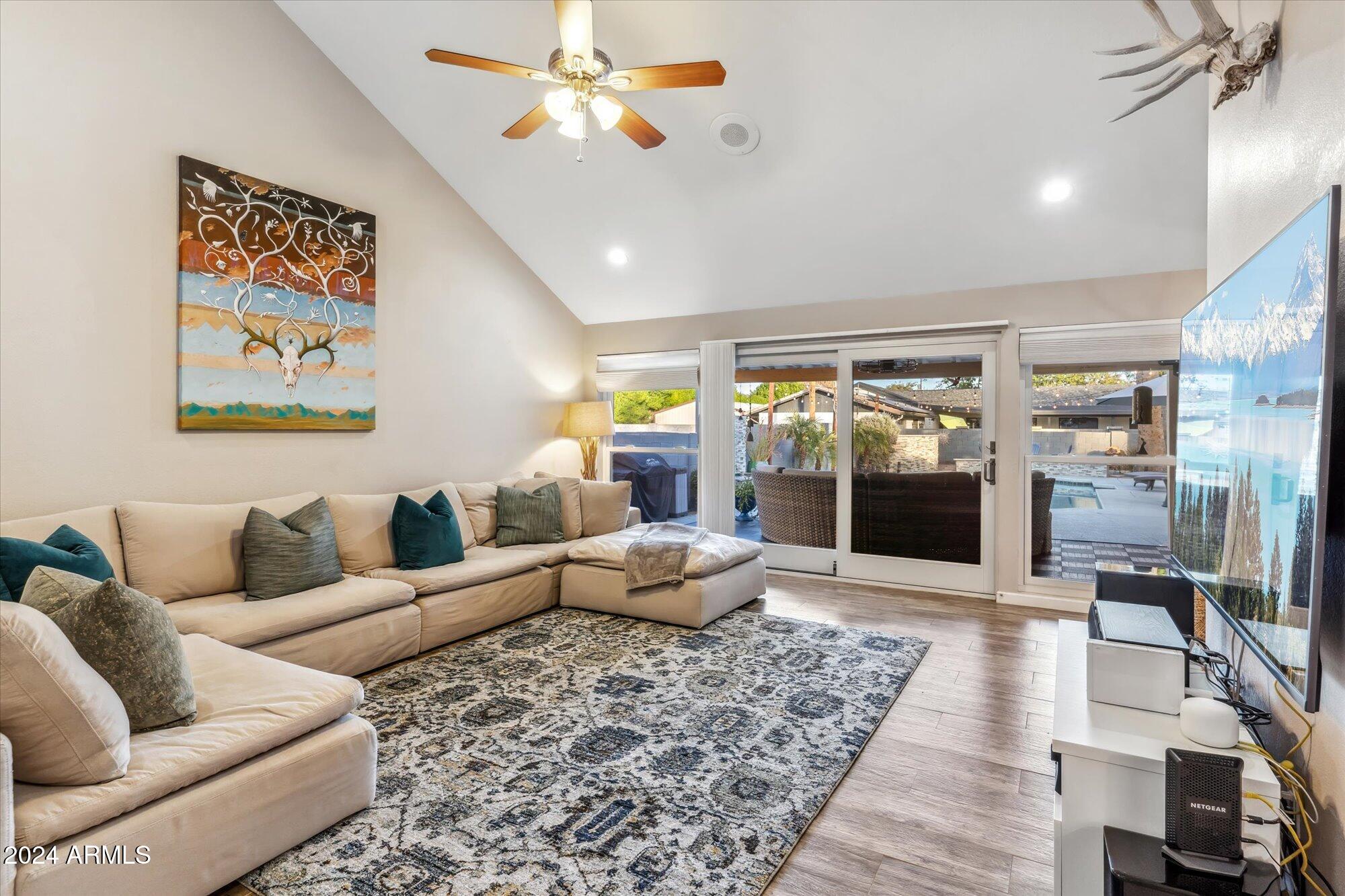 8019 North 7th Avenue Phoenix, AZ 85021 - Photo 15 of 43 a living room with furniture and a flat screen tv